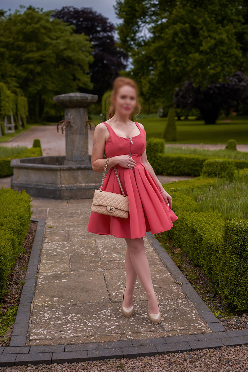 Elegant British escort in her Gloucestershire country garden